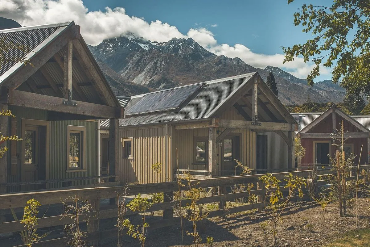 Camp Glenorchy accommodation buildings and mountain landscape