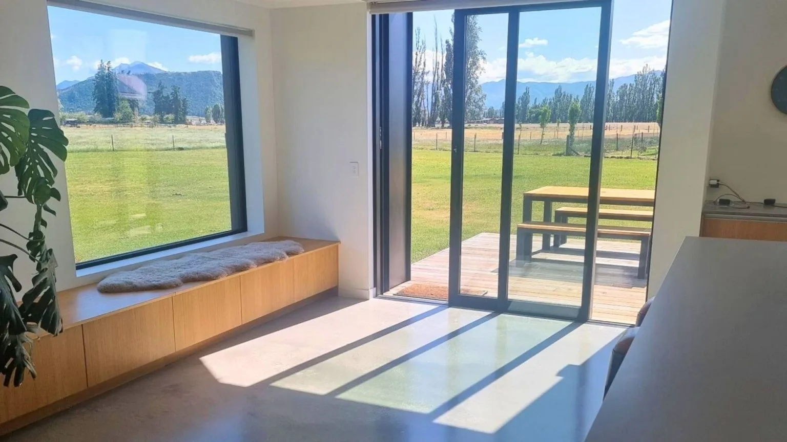 Sunlit finished interior of The Henderson Home looking towards the mountains