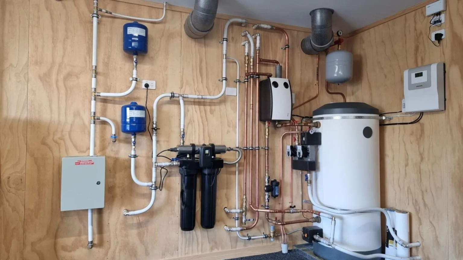 The Henderson Home plant room with hot water cylinder and filtration equipment