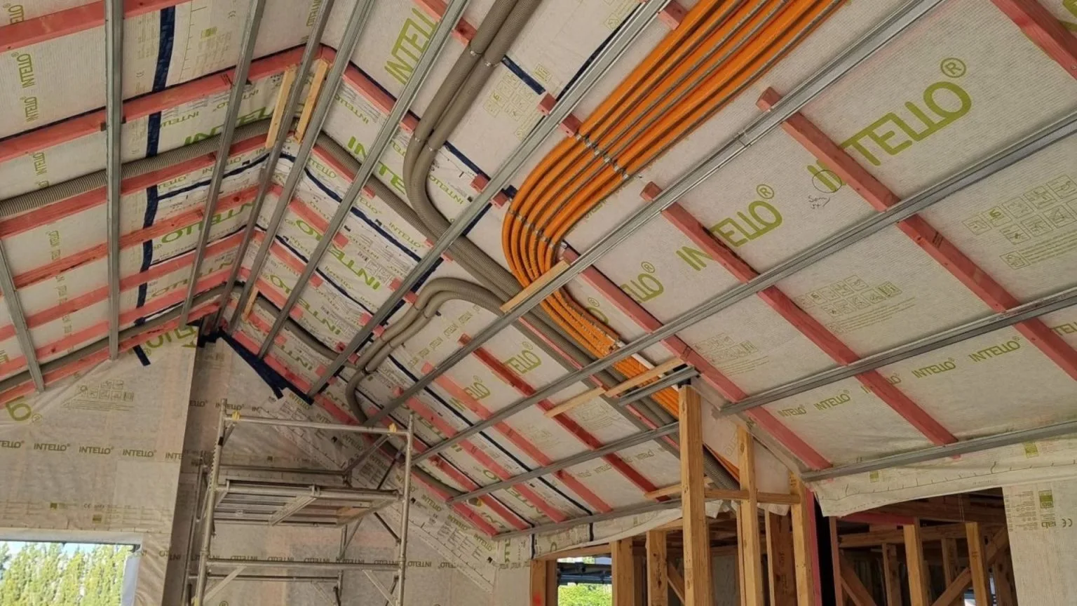 Heating and building services installed within the insulated ceiling