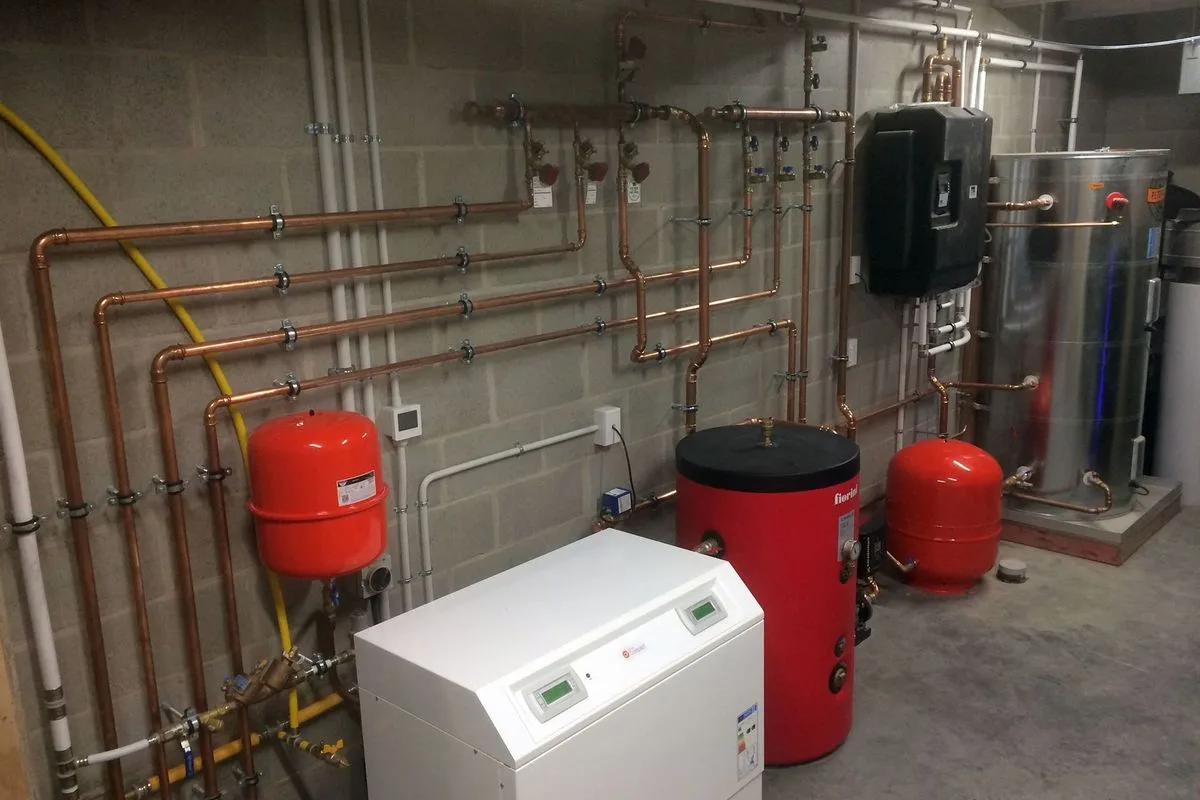 Hidden Island ground-source plant room with copper distribution pipework